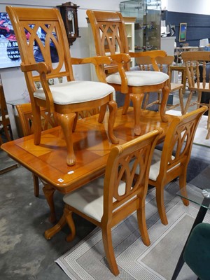 Lot 1219 - Yew finish extending dining suite with 6 (4+2)...