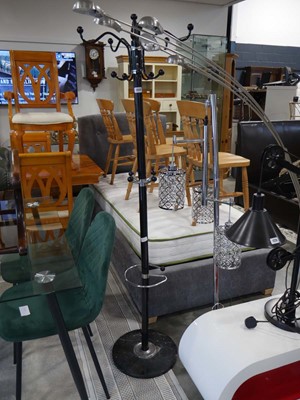 Lot 1222 - Free standing hat and coat stand in black and...