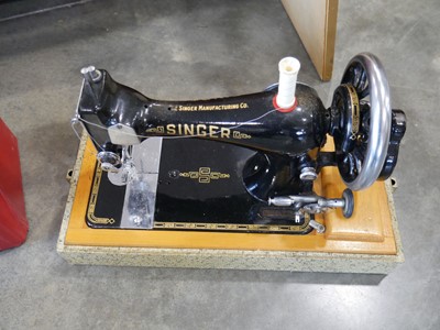 Lot 1285 - Singer manual operated sewing machine in hard...