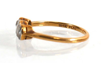 Lot 704 - An 18ct yellow gold ring set three graduated...