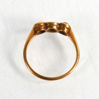 Lot 704 - An 18ct yellow gold ring set three graduated...