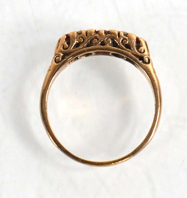 Lot 711 - A 9ct yellow gold ring set three graduated...