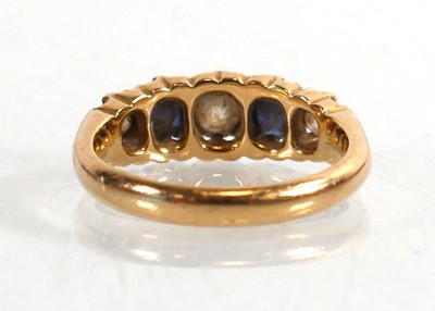 Lot 720 - An Edwardian 18ct yellow gold ring set three...