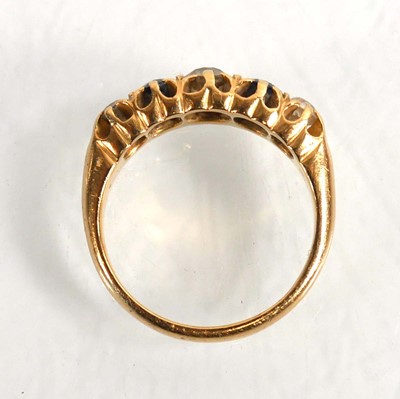 Lot 720 - An Edwardian 18ct yellow gold ring set three...