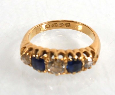 Lot 720 - An Edwardian 18ct yellow gold ring set three...