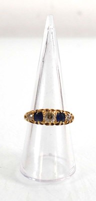 Lot 720 - An Edwardian 18ct yellow gold ring set three...