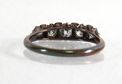 Lot 721 - An 18ct white gold ring set five gradated...