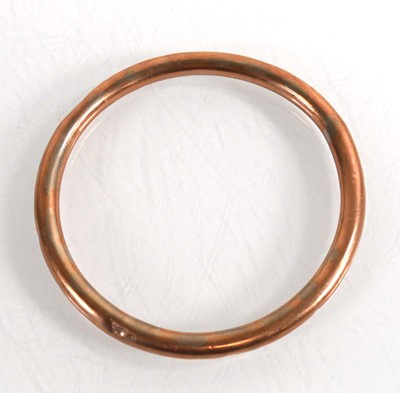 Lot 726 - A 9ct rose gold hollow slave bangle, internal...