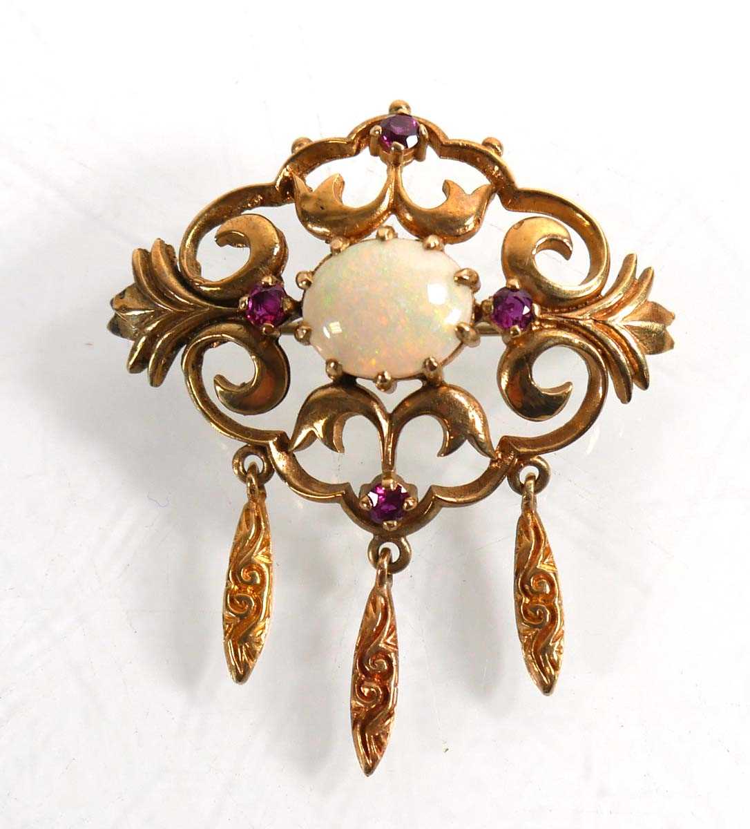 Lot 729 - A 9ct yellow gold brooch of Rococo design set...