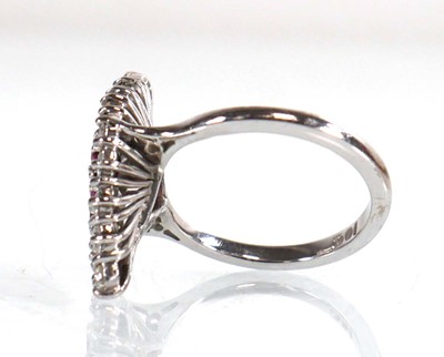 Lot 735 - An 18ct white gold cocktail ring set sixteen...