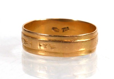 Lot 743 - An 18ct yellow gold wedding band with sunburst...