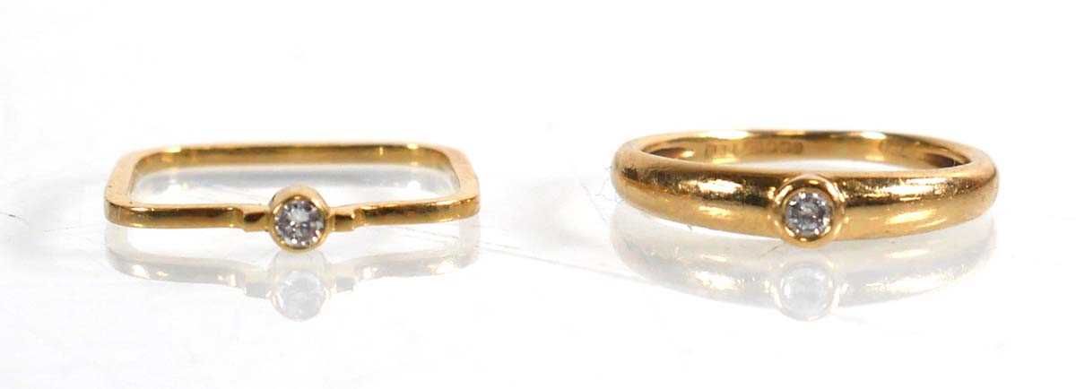 Lot 745 - Two 18ct yellow gold rings, each set a small...