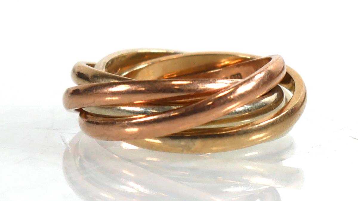 Lot 746 - A 9ct tri-colour six band ring, ring size E, 8....