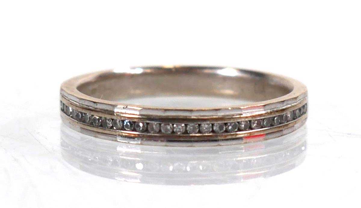 Lot 762 - A 9ct white gold half eternity ring set small...