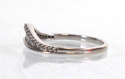 Lot 764 - A 9ct white gold half eternity ring set...