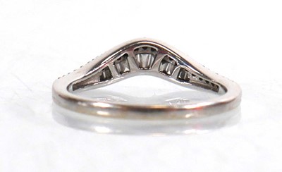 Lot 764 - A 9ct white gold half eternity ring set...