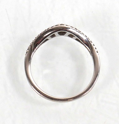 Lot 764 - A 9ct white gold half eternity ring set...