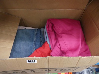 Lot 3284 - Box of mixed clothing to include Champion,...