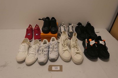 Lot 1653 - A bag containing 8 pairs of trainers in...