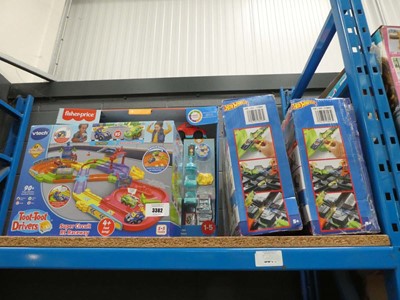 Lot 3382 - 2 Hotwheel sets plus VTech and Fisher Price...