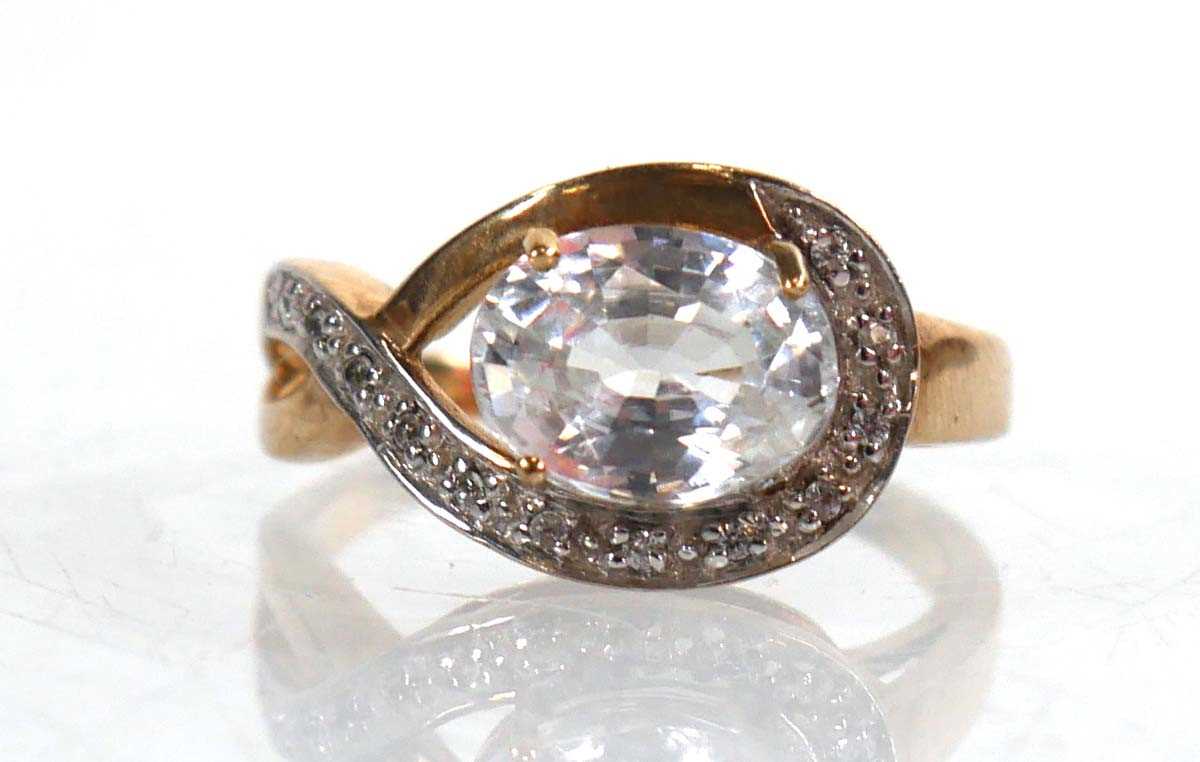 Lot 766 - A 9ct yellow gold ring set oval cubic zirconia...