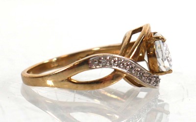 Lot 766 - A 9ct yellow gold ring set oval cubic zirconia...