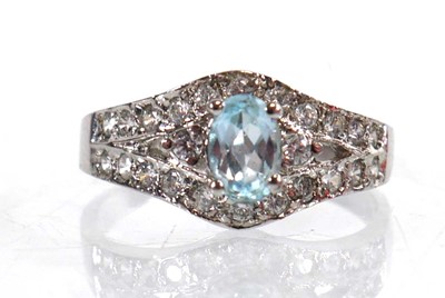 Lot 767 - A 9ct white gold ring set pale blue stone and...