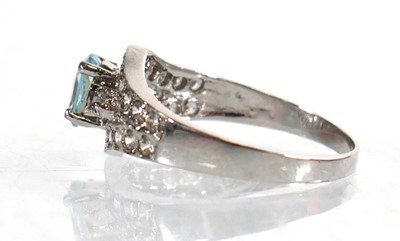 Lot 767 - A 9ct white gold ring set pale blue stone and...