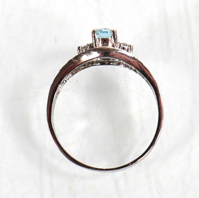 Lot 767 - A 9ct white gold ring set pale blue stone and...