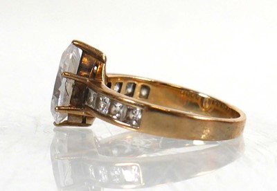 Lot 770 - A 9ct yellow gold ring set teardrop cubic...