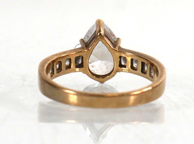 Lot 770 - A 9ct yellow gold ring set teardrop cubic...