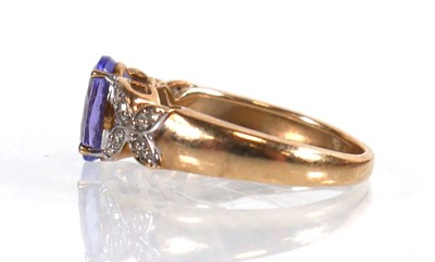 Lot 772 - A 9ct yellow gold ring set oval cut tanzanite...