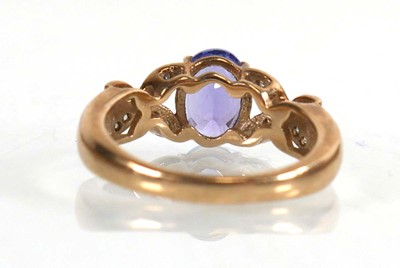 Lot 772 - A 9ct yellow gold ring set oval cut tanzanite...