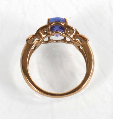 Lot 772 - A 9ct yellow gold ring set oval cut tanzanite...