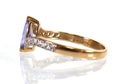 Lot 773 - A 9ct yellow gold ring set marquise cut...