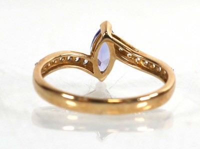 Lot 773 - A 9ct yellow gold ring set marquise cut...