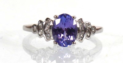 Lot 775 - A 9ct white gold ring set oval cut tanzanite...