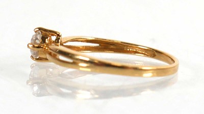 Lot 776 - An 18ct yellow gold ring set brilliant cut...