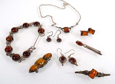 Lot 785 - A group of amber set silver jewellery...