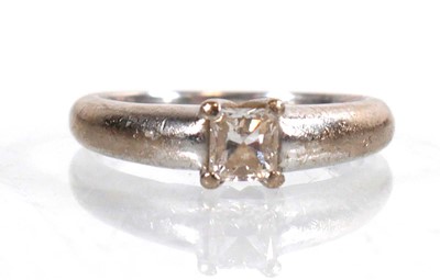 Lot 786 - An 18ct white gold ring set princess cut...