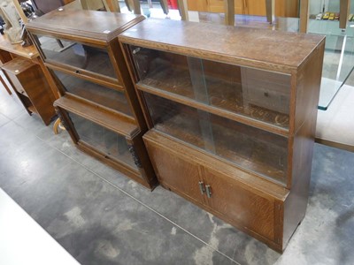 Lot 1516 - 2 similar dark oak book cases, 1 by Minty