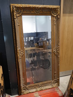 Lot 1561 - Large rectangular beveled mirror in an ornate...