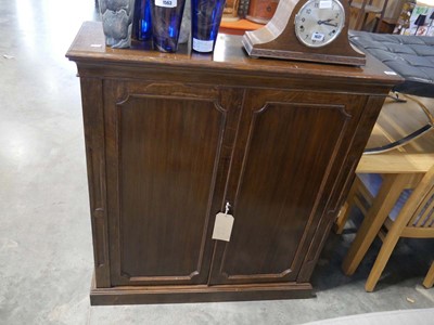 Lot 1562 - Dark oak double door cupboard with interior...