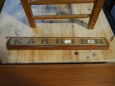 Lot 1576 - "KARRIER" brass plaque mounted on wooden...