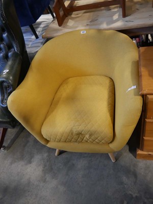 Lot 1585 - Modern yellow upholstered tub shaped easy...