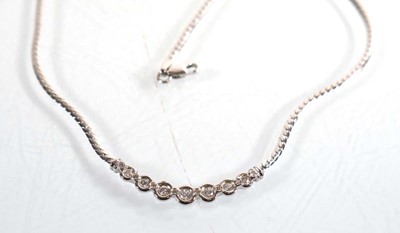 Lot 787 - A 9ct white gold flat curblink necklace set...