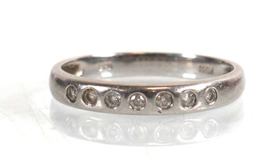 Lot 788 - A platinum half eternity ring set seven small...