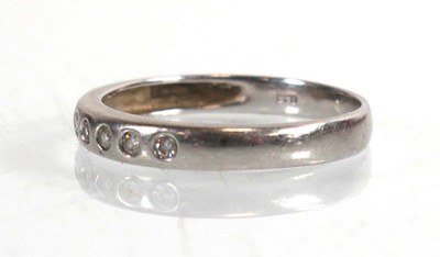 Lot 788 - A platinum half eternity ring set seven small...