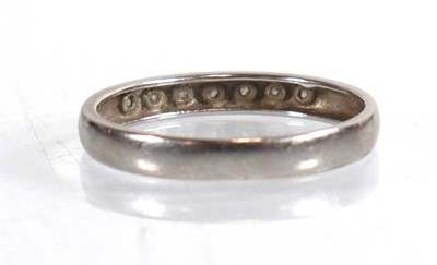 Lot 788 - A platinum half eternity ring set seven small...