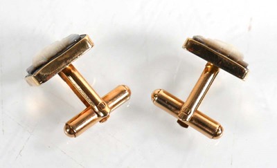 Lot 790 - A pair of 14ct yellow gold cufflinks, each set...